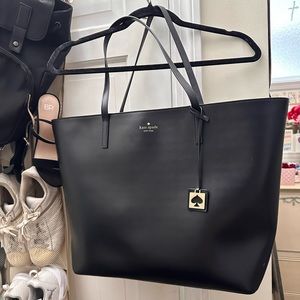 Large black Kate Spade tote. It is in great condition, barely used.